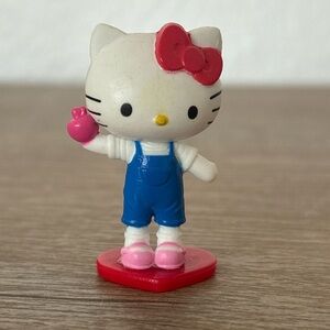 Sanrio Hello Kitty Mini Figurine – 1.75”‎ Blue Overalls, Red Heart Base – 2015